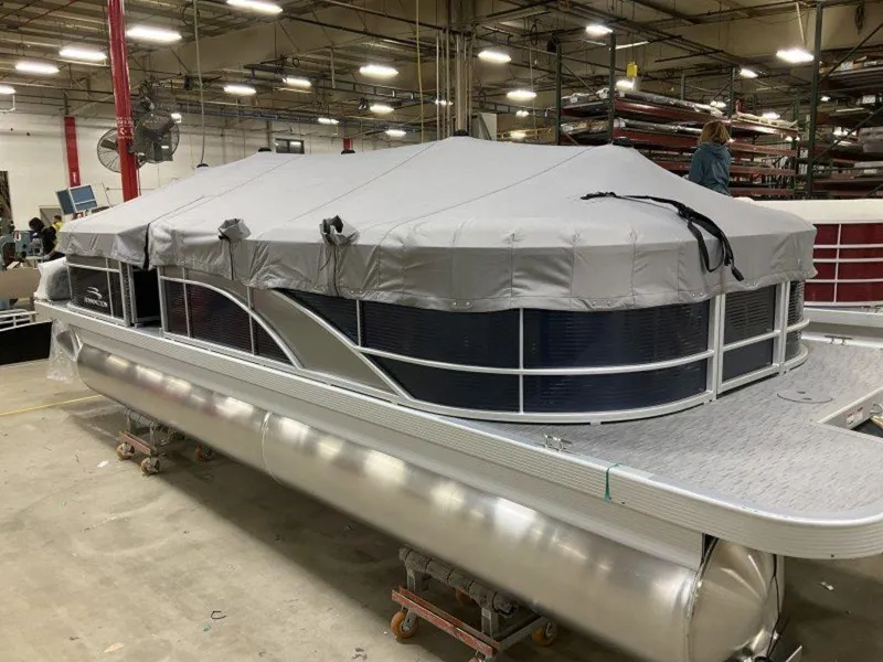 Slide: The Image of 2023 Bennington 23 SXSR pontoon boat with cover in a warehouse. - 7