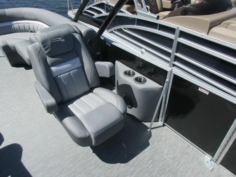 Slide: The Image of 2023 Bennington 24 LXFBA boat interior with captain's chair and console. - 11
