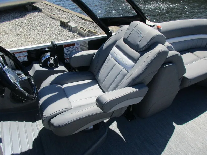 Slide: The Image of 2023 Bennington 24 LXFBA boat captain's chair and helm station. - 6
