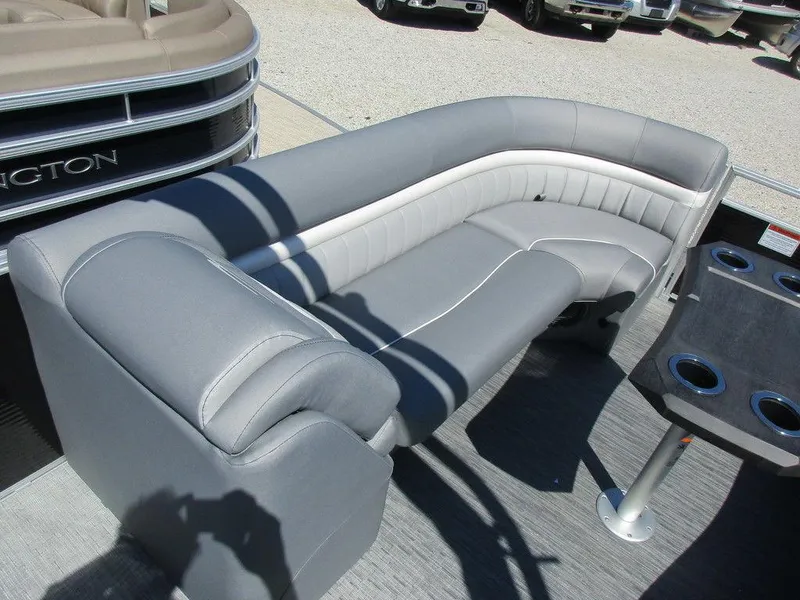 Slide: The Image of 2023 Bennington 24 LXFBA boat with gray and white cushioned seating. - 9