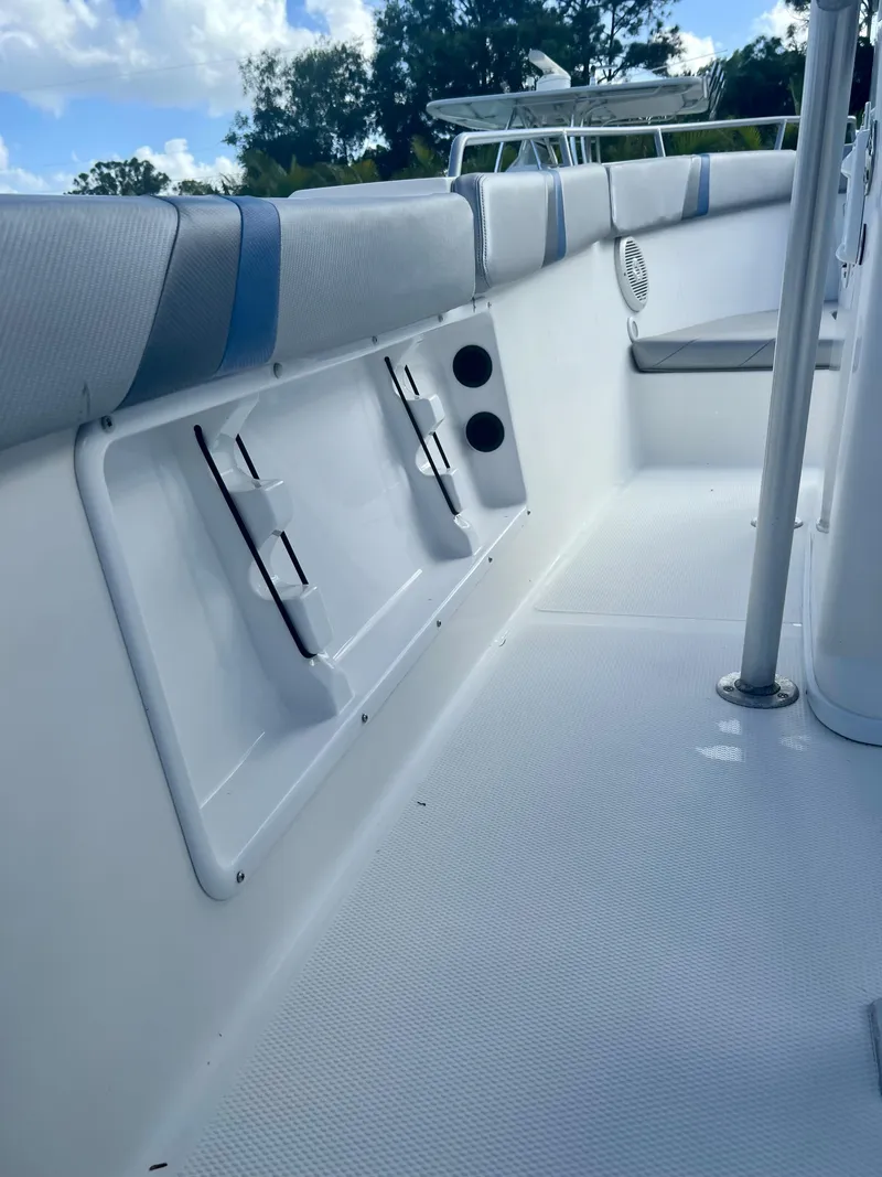 Slide: The Image of 2016 Renegade 250 boat interior with seating and storage compartments. - 10