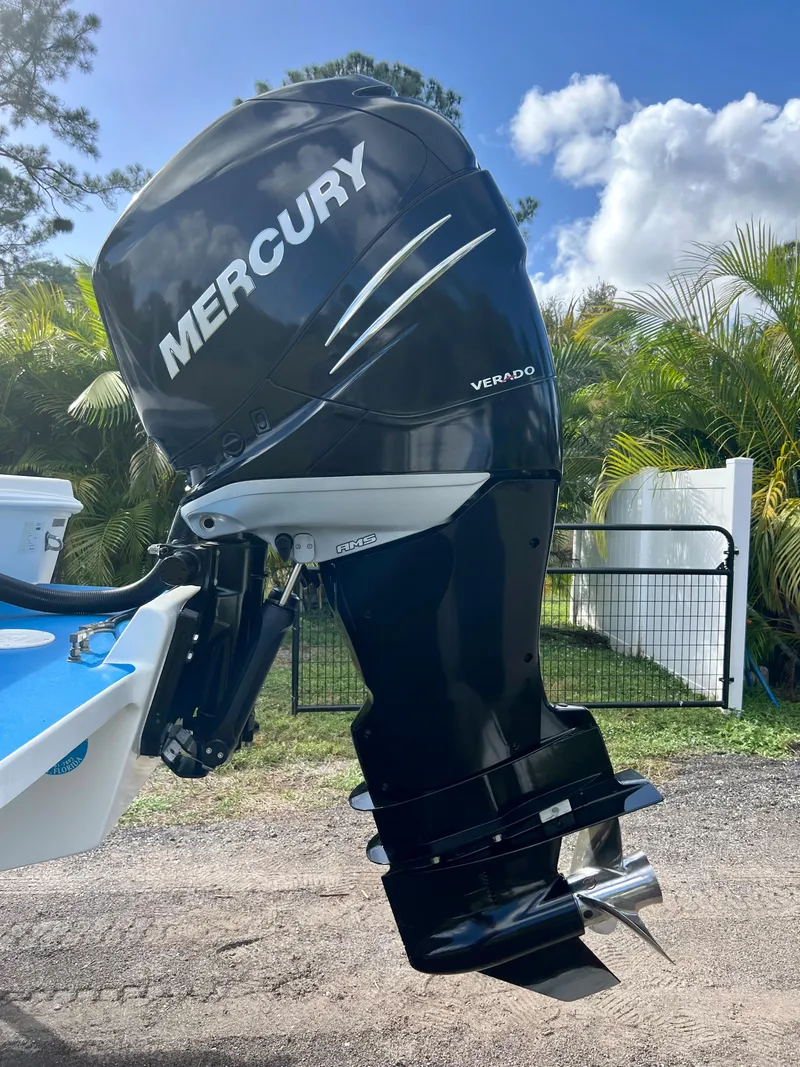Slide: The Image of Mercury Verado outboard motor on a 2016 Renegade 250 boat, sunny day background. - 11