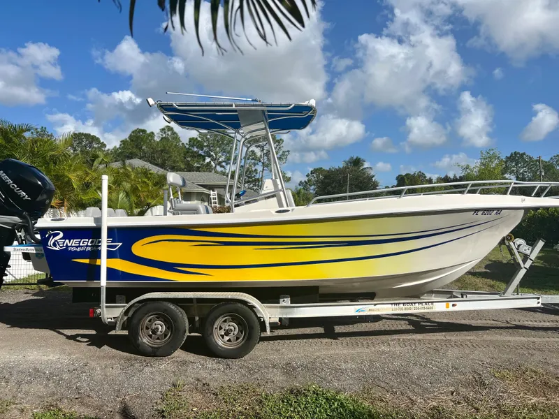 Slide: The Image of 2016 Renegade 250 boat with yellow and blue graphics on a trailer. - 3