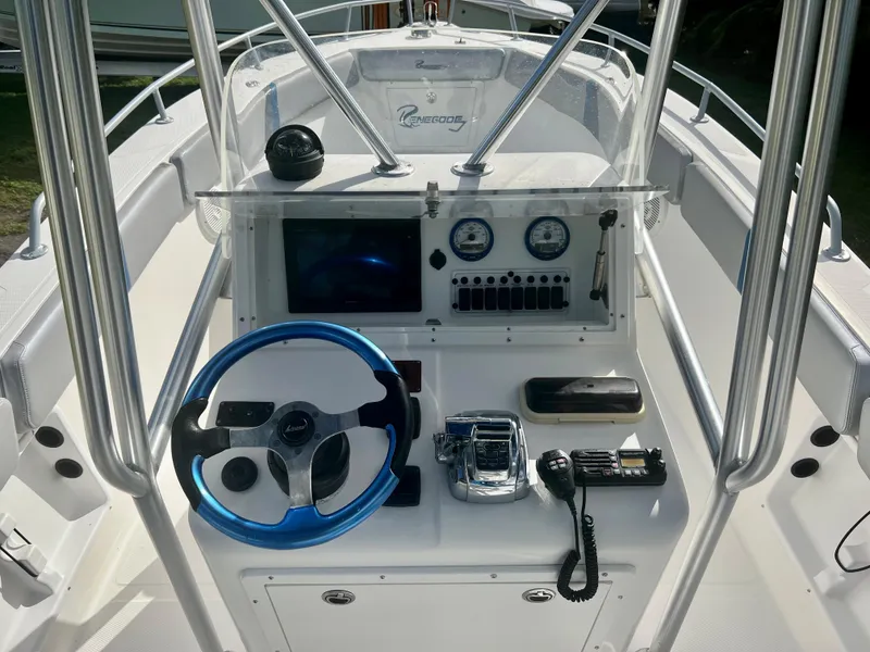 Slide: The Image of 2016 Renegade 250 boat console with steering wheel, gauges, and controls. - 7