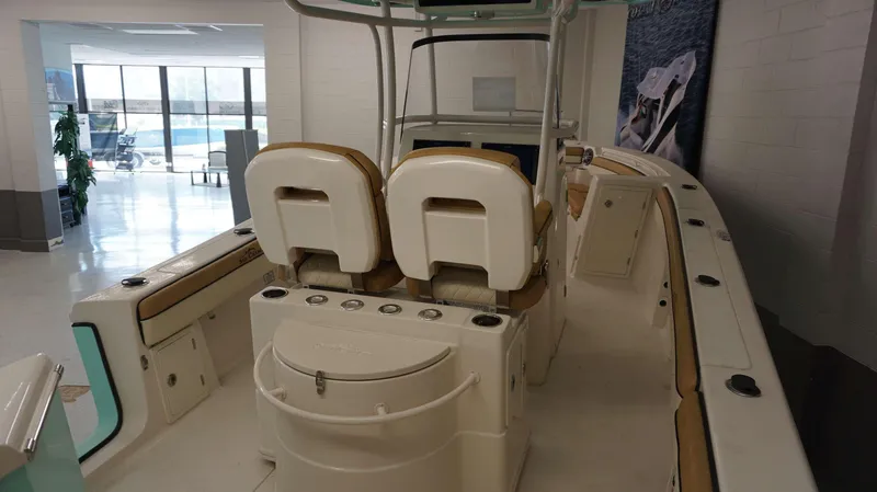 Slide: The Image of 2023 Sea Chaser 27 HFC boat interior with dual seats and storage compartments. - 13