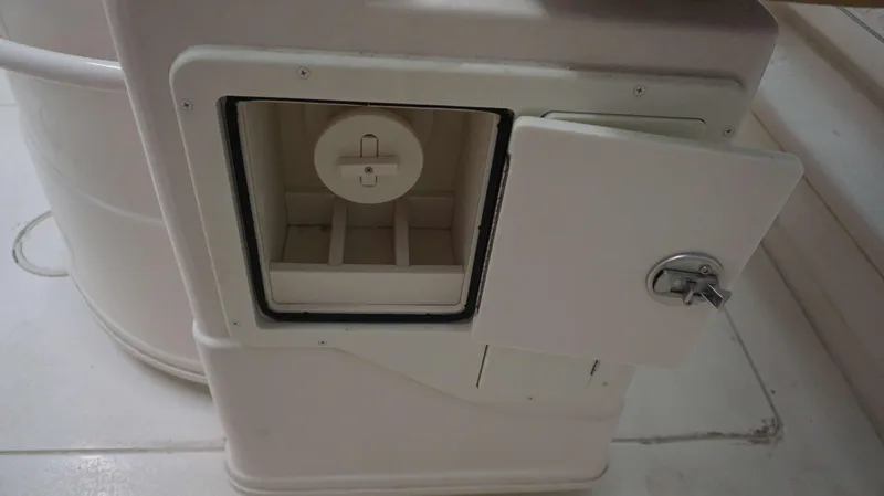 Slide: The Image of 2023 Sea Chaser 27 HFC boat compartment with open storage hatch. - 16