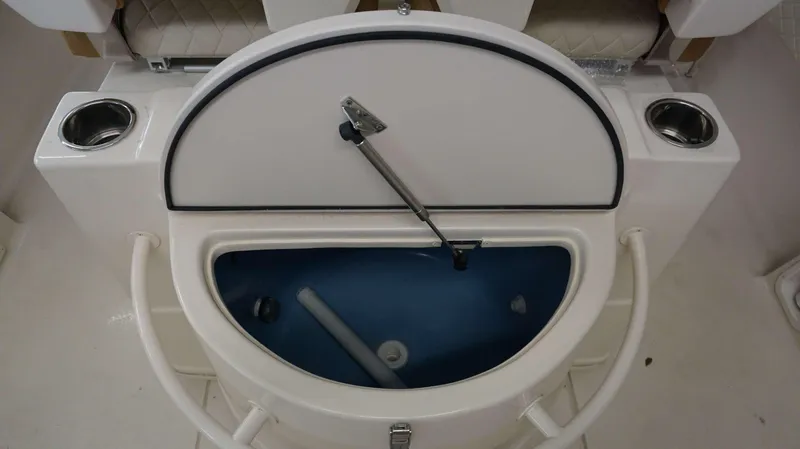 Slide: The Image of 2023 Sea Chaser 27 HFC livewell with open lid and cup holders. - 18