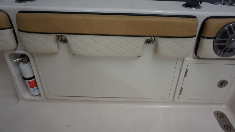 Slide: The Image of Interior of 2023 Sea Chaser 27 HFC boat with storage compartments and fire extinguisher. - 20