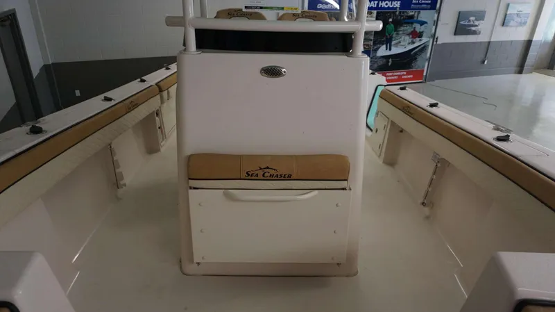 Slide: The Image of 2023 Sea Chaser 27 HFC boat interior with seating and storage compartments. - 30