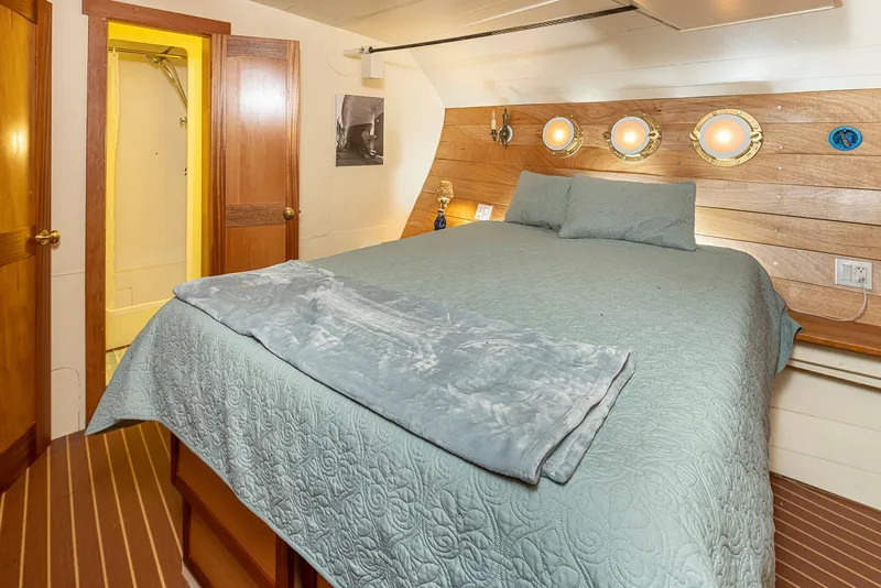 Slide: The Image of Cozy bedroom with nautical decor on a 1943 Custom Navy Tug boat. - 34