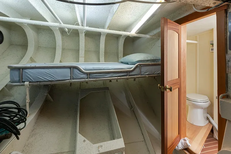 Slide: The Image of Interior of a 1943 Custom Navy Tug with a bunk bed and bathroom. - 38