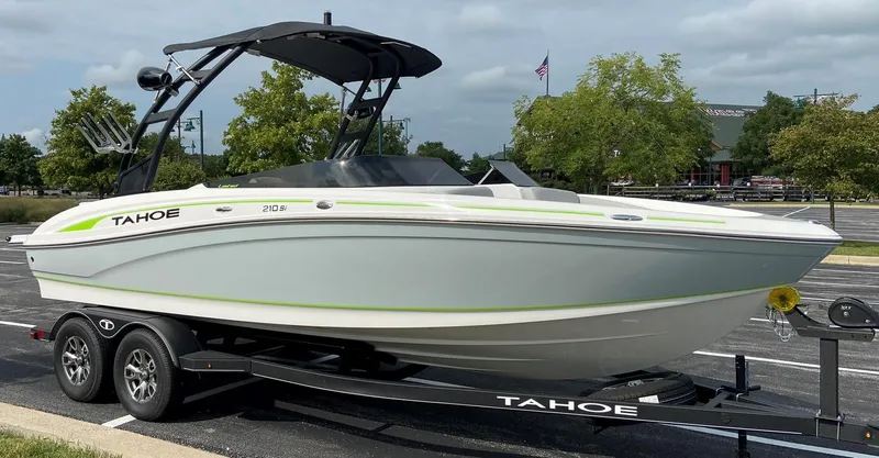 Slide: The Image of 2023 Tahoe 210 Si Limited boat on trailer in parking lot. - 5