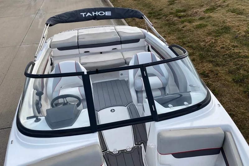 Slide: The Image of 2023 Tahoe 210 Si boat interior with seating and steering wheel, viewed from above. - 7
