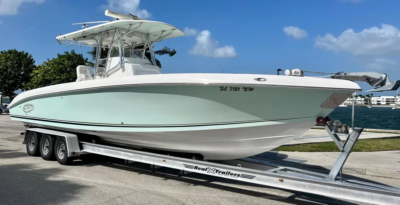 Slide: The Image of 2009 Spectre Sportfish boat on trailer by the waterfront. - 1