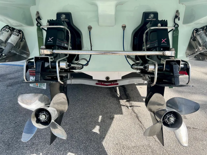 Slide: The Image of 2009 Spectre Sportfish boat with dual Mercury outboard motors and propellers. - 13