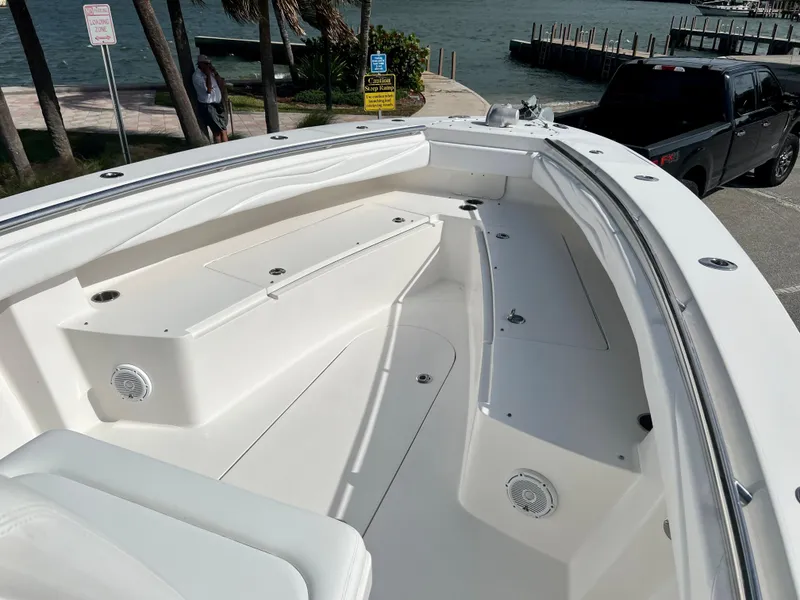 Slide: The Image of 2009 Spectre Sportfish boat interior with seating and storage compartments. - 17