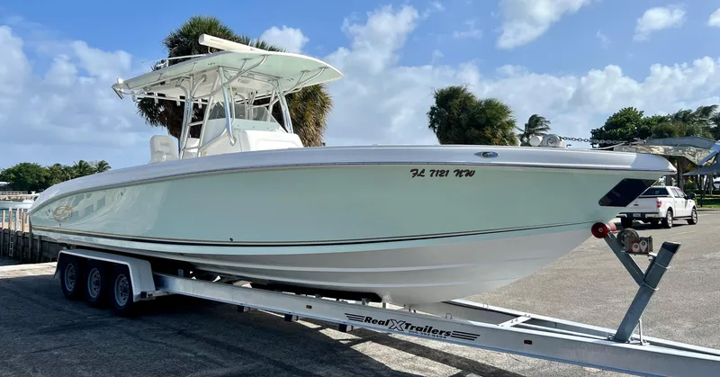 Slide: The Image of 2009 Spectre Sportfish boat on trailer in sunny marina. - 2