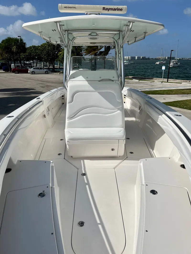 Slide: The Image of 2009 Spectre Sportfish boat with Raymarine electronics, docked near a waterfront. - 20