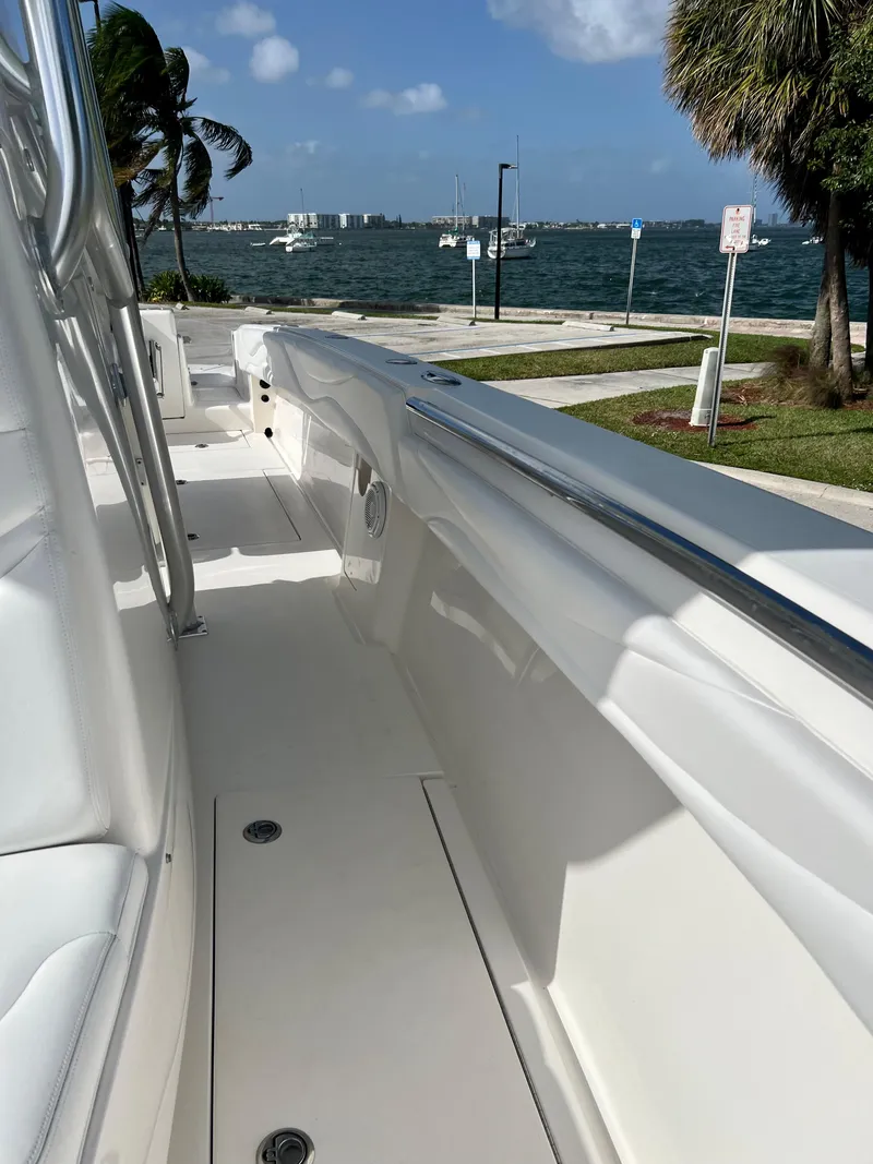 Slide: The Image of 2009 Spectre Sportfish boat docked by the waterfront on a sunny day. - 22