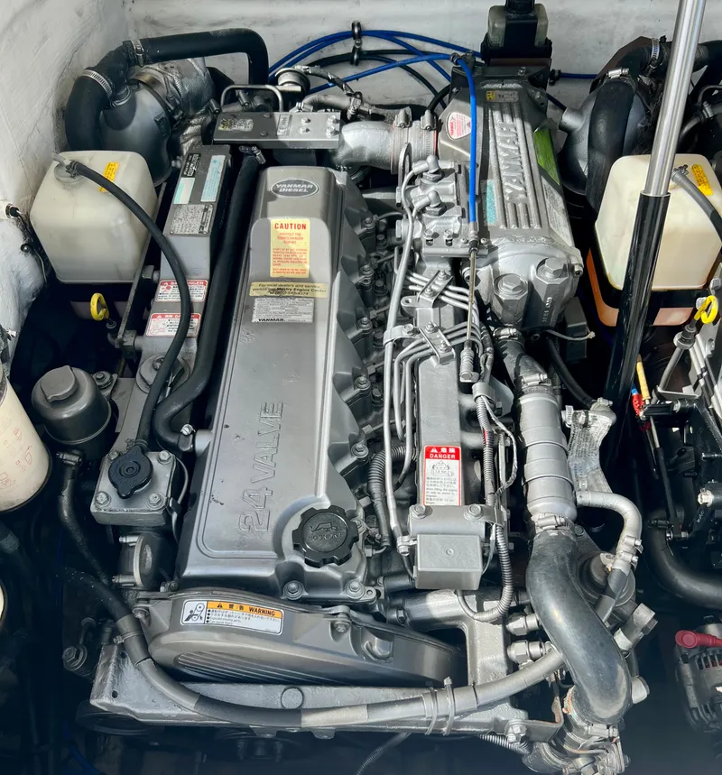 Slide: The Image of 2009 Spectre Sportfish engine compartment with detailed components. - 27