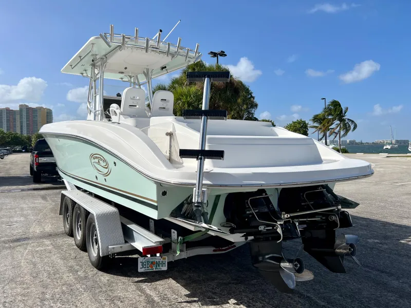 Slide: The Image of 2009 Spectre Sportfish boat on trailer in sunny parking lot. - 34