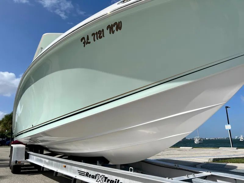 Slide: The Image of 2009 Spectre Sportfish boat on a Real X-Trail trailer by the waterfront. - 4