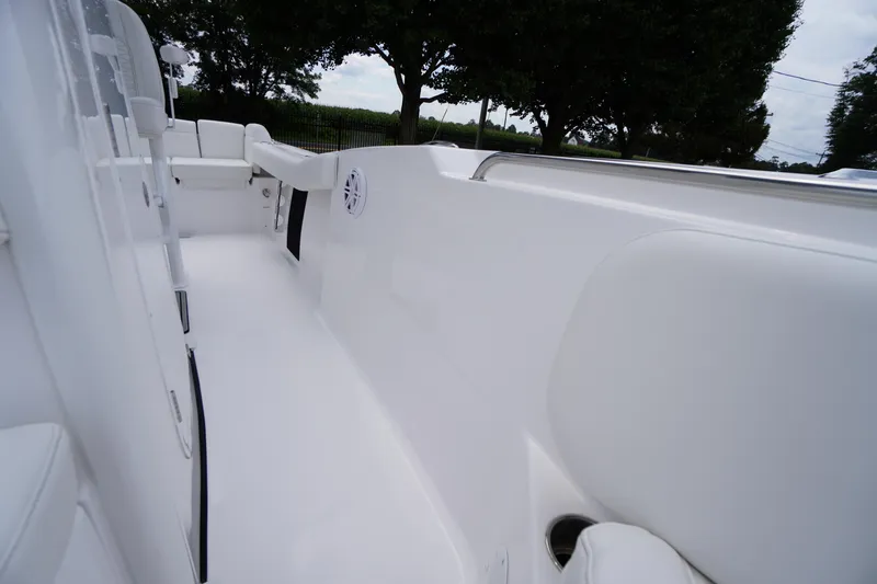 Slide: The Image of 2026 Tidewater 232 SS boat interior, featuring sleek white seating and modern design elements. - 24