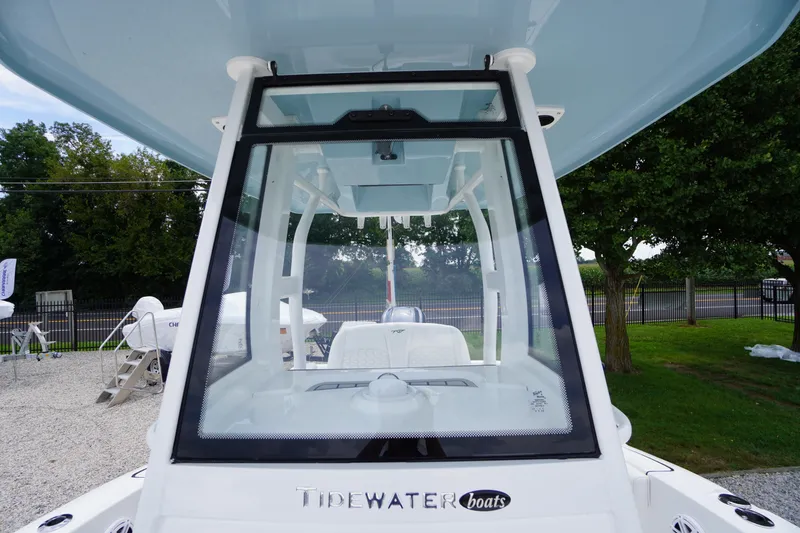 Slide: The Image of 2026 Tidewater 232 SS boat with sleek windshield and modern design. - 26