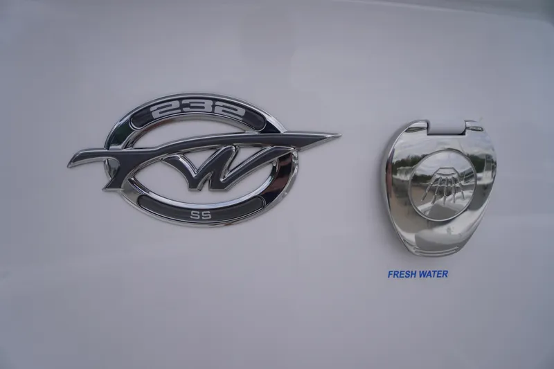 Slide: The Image of Tidewater 232 SS 2026 emblem and fresh water access on boat exterior. - 28
