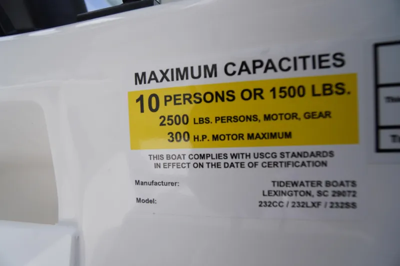 Slide: The Image of 2026 Tidewater 232 SS boat capacity label, 10 persons or 1500 lbs, 300 HP motor max. - 39