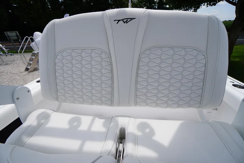 Slide: The Image of 2026 Tidewater 232 SS boat seat with white hexagonal stitching design. - 42