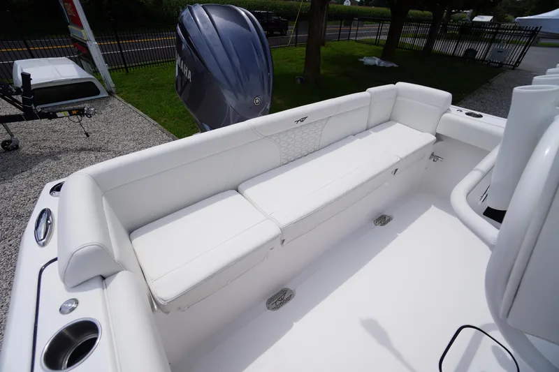 Slide: The Image of 2026 Tidewater 232 SS boat with white seating and Yamaha outboard engine. - 48