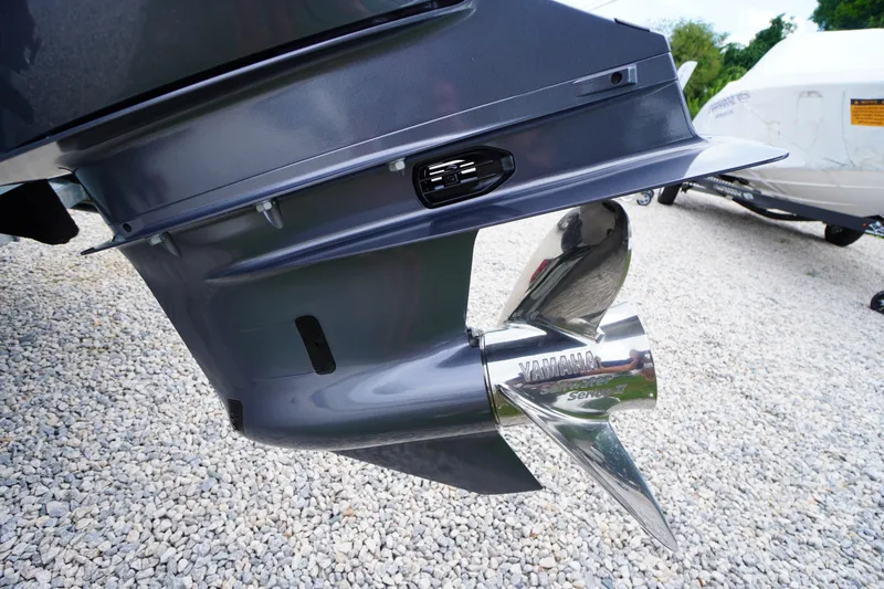 Slide: The Image of Close-up of a 2026 Tidewater 232 SS boat's Yamaha propeller on gravel. - 80