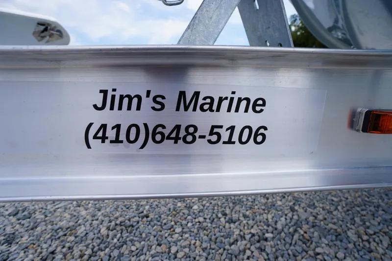 Slide: The Image of Jim's Marine contact information on a Tidewater 232 SS boat trailer, 2026 model. - 81