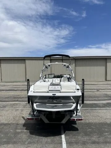 Slide: The Image of Rear view of a 2021 Tigé 25ZX boat in a parking lot. - 10