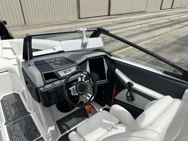 Slide: The Image of Interior view of 2021 Tigé 25ZX boat with modern cockpit. - 5