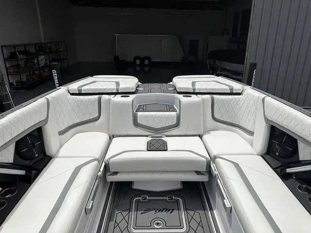 Slide: The Image of Interior of a 2021 Tigé 25ZX boat with luxurious white upholstery. - 6