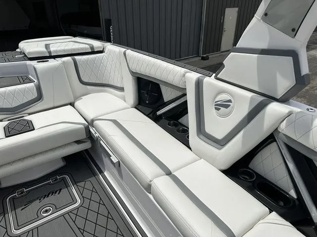 Slide: The Image of Interior of 2021 Tigé 25ZX with luxurious white upholstery. - 7