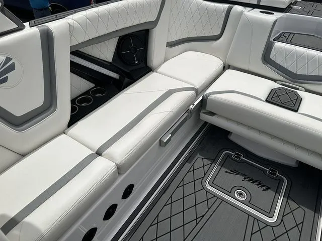 Slide: The Image of Interior of 2021 Tigé 25ZX with luxurious white upholstery. - 8