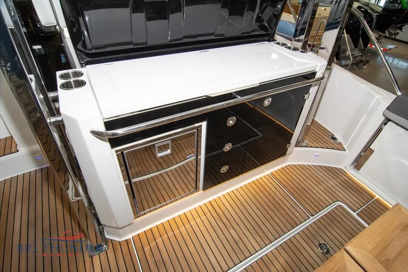 Slide: The Image of 2022 Jeanneau Leader 10.5 yacht interior with sleek cabinetry and teak flooring. - 34