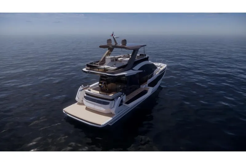 Slide: The Image of 2023 Galeon 560 Fly luxury yacht cruising on open water. - 10