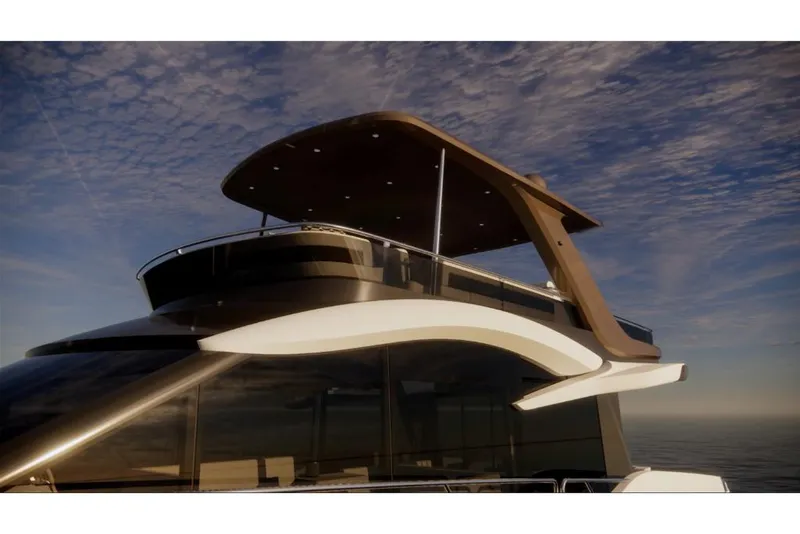 Slide: The Image of 2023 Galeon 560 Fly yacht with modern flybridge design against a cloudy sky. - 15