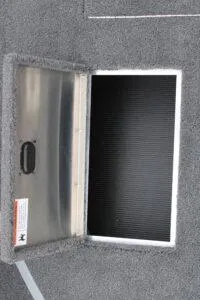Slide: The Image of Open storage compartment on a 2023 Lowe Fishing Machine 162 boat. - 13