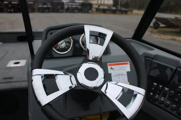 Slide: The Image of 2023 Lowe FISHING MACHINE 162 steering wheel and dashboard close-up. - 9