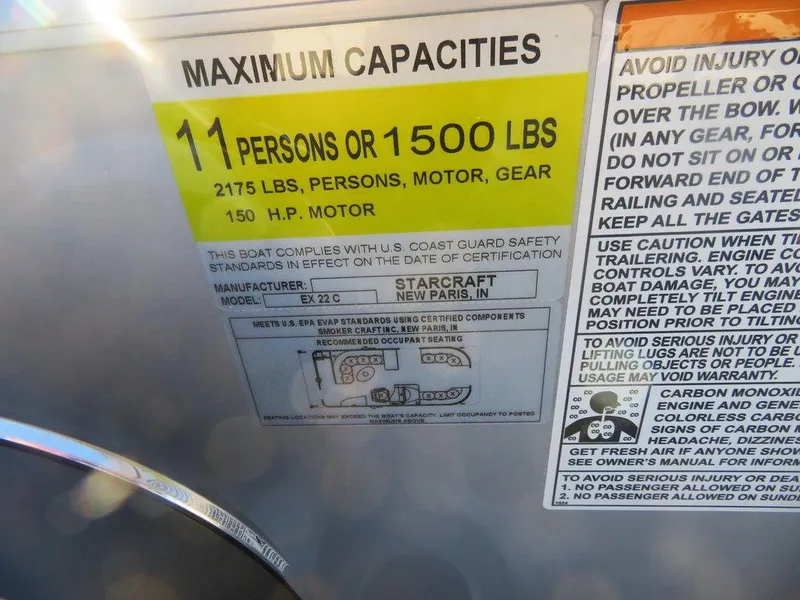 Slide: The Image of 2023 Starcraft EX 22 C boat capacity label, 11 persons or 1500 lbs, 150 HP motor. - 10