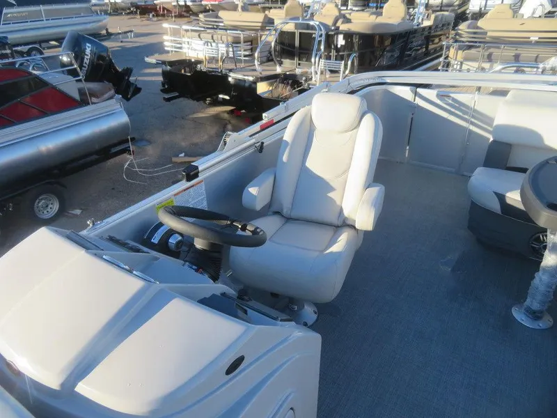 Slide: The Image of 2023 Starcraft EX 22 C pontoon boat captain's chair and helm. - 12