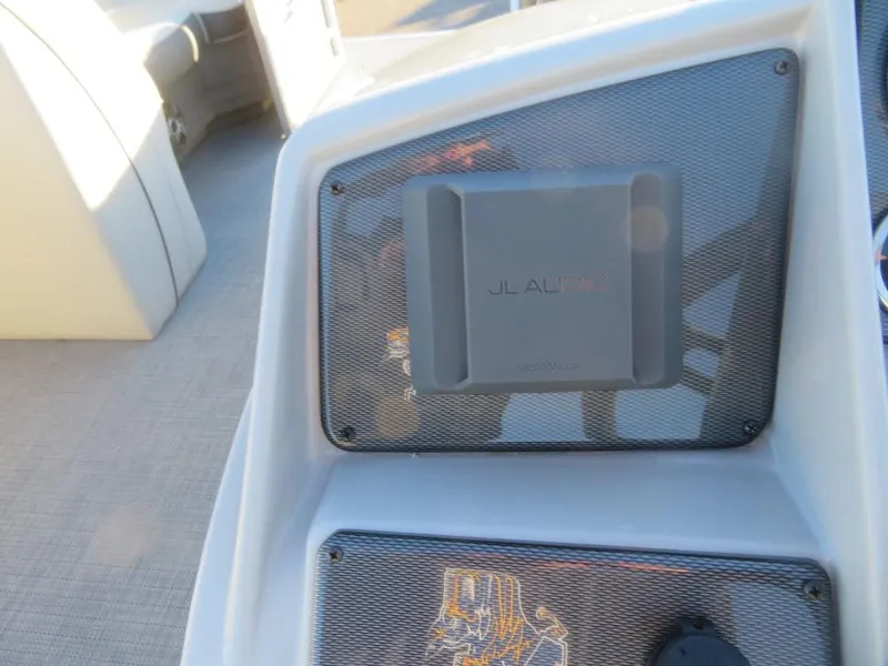 Slide: The Image of 2023 Starcraft EX 22 C boat dashboard with JL Audio speaker. - 15