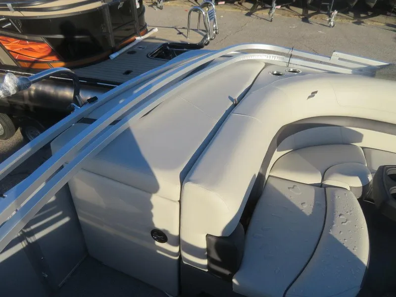 Slide: The Image of 2023 Starcraft EX 22 C boat interior with cushioned seating and sleek design. - 17