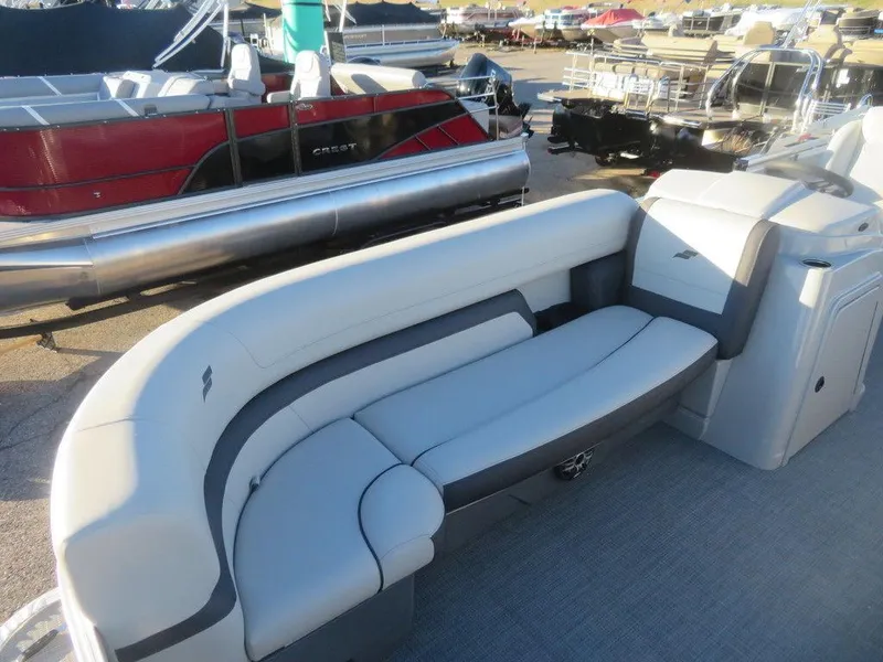 Slide: The Image of 2023 Starcraft EX 22 C pontoon boat with gray seating and spacious deck. - 5