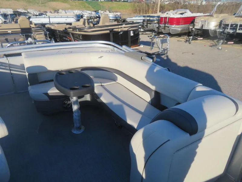 Slide: The Image of 2023 Starcraft EX 22 C pontoon boat with spacious seating and table. - 7